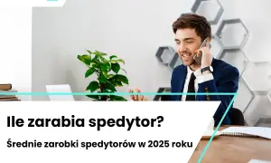 Uśmiechnięty mężczyzna w garniturze rozmawia przez telefon w nowoczesnym biurze.
